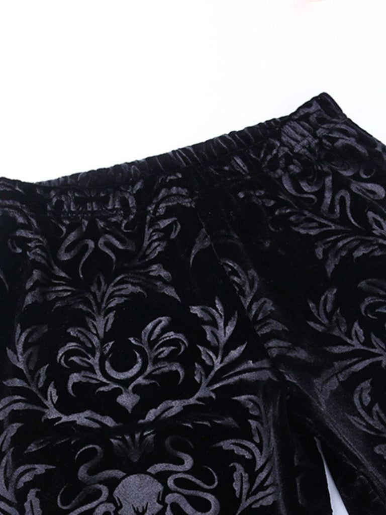 Pantaloni bootcut in velluto con stampa punk anni '80