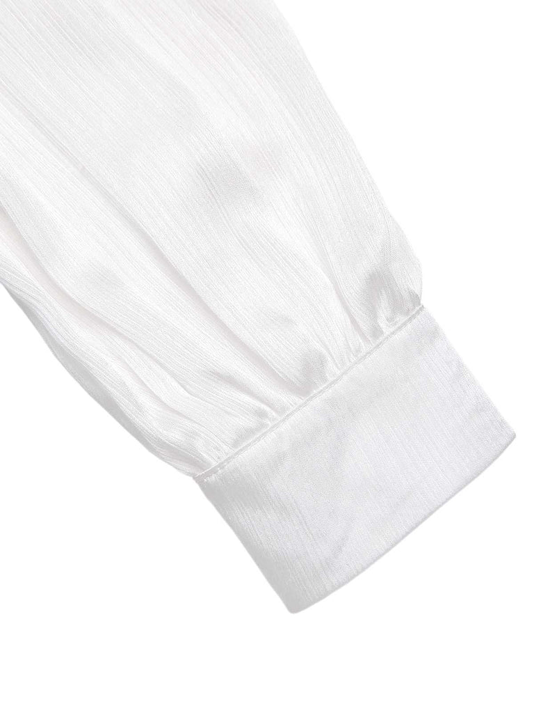 Tuta lunga con colletto arricciato e fiocco nero anni '30