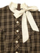 Abito a quadri con bottoni e fiocco marrone anni '60