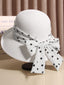 Cappello di paglia bianco con fiocco a pois