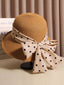 Cappello di paglia marrone chiaro con fiocco a pois