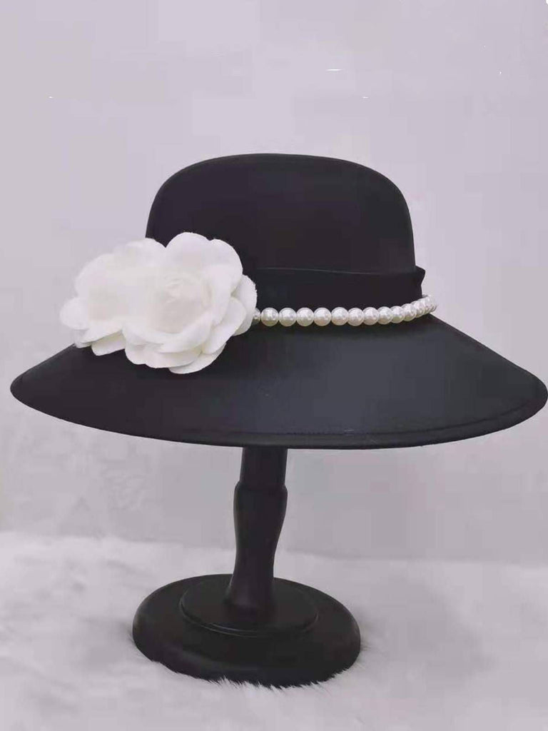 Cappello tinta unita con fiori di perle nero
