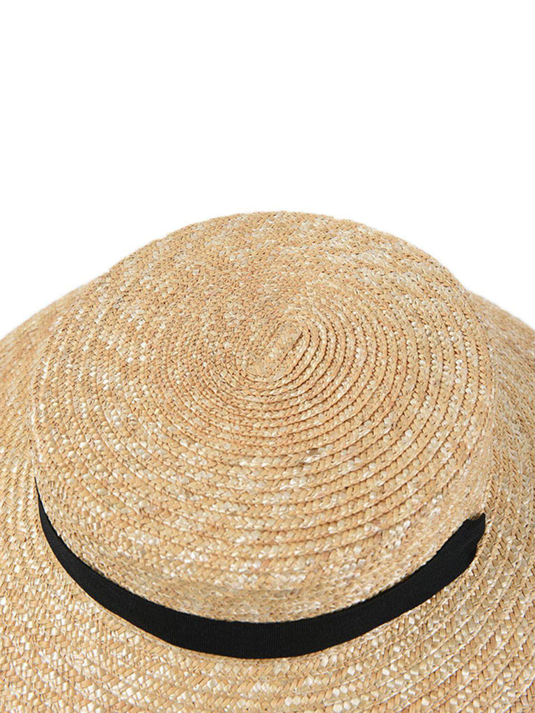 Cappello in rafia intrecciata con nastro nero