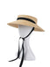 Cappello in rafia intrecciata con nastro nero