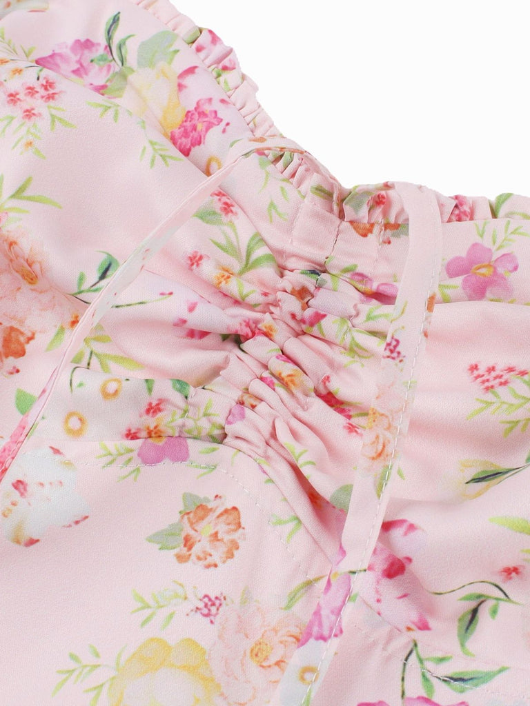 Abito con lacci floreali e spalline larghe anni '40