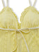 Yellow lace bra with a bow on a white background