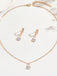 Set di orecchini pendenti e collana in oro