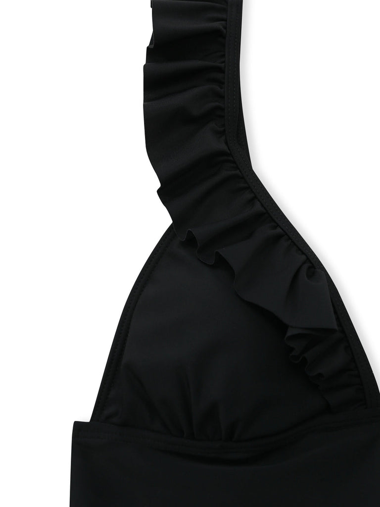Black ruffled swimsuit top on a white background