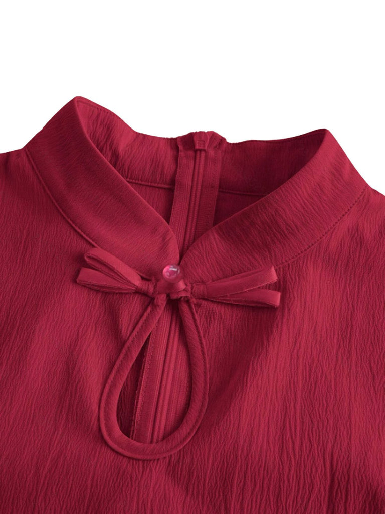 Abito con maniche a pipistrello e colletto rialzato rosso anni '50