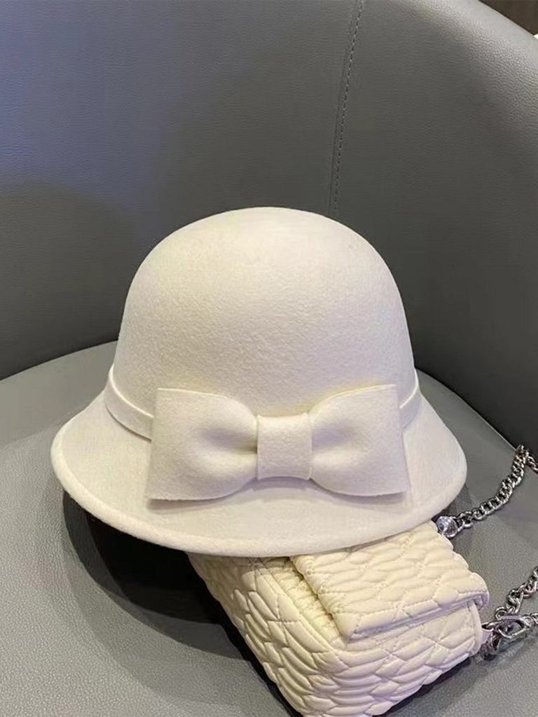 Cappello a cloche con fiocco in lana sintetica