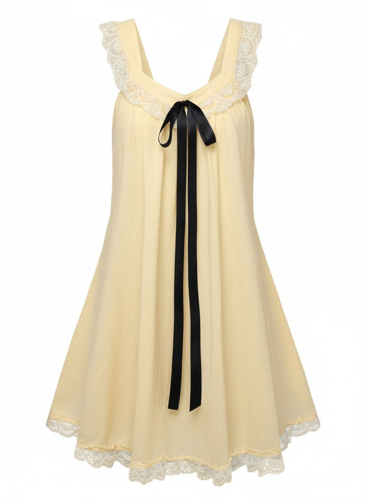 Abito babydoll in pizzo con fiocco sulla schiena anni '60