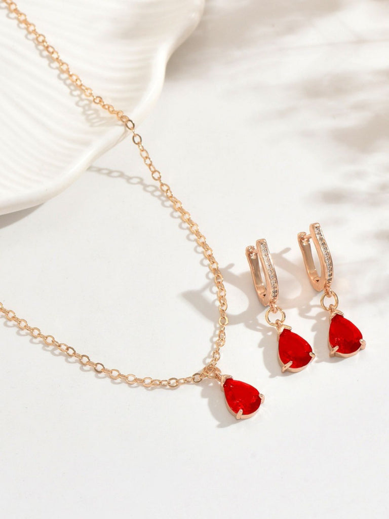 Set di orecchini pendenti e collana in oro