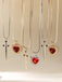2PCS Collana con rubino a forma di cuore e spada in strass