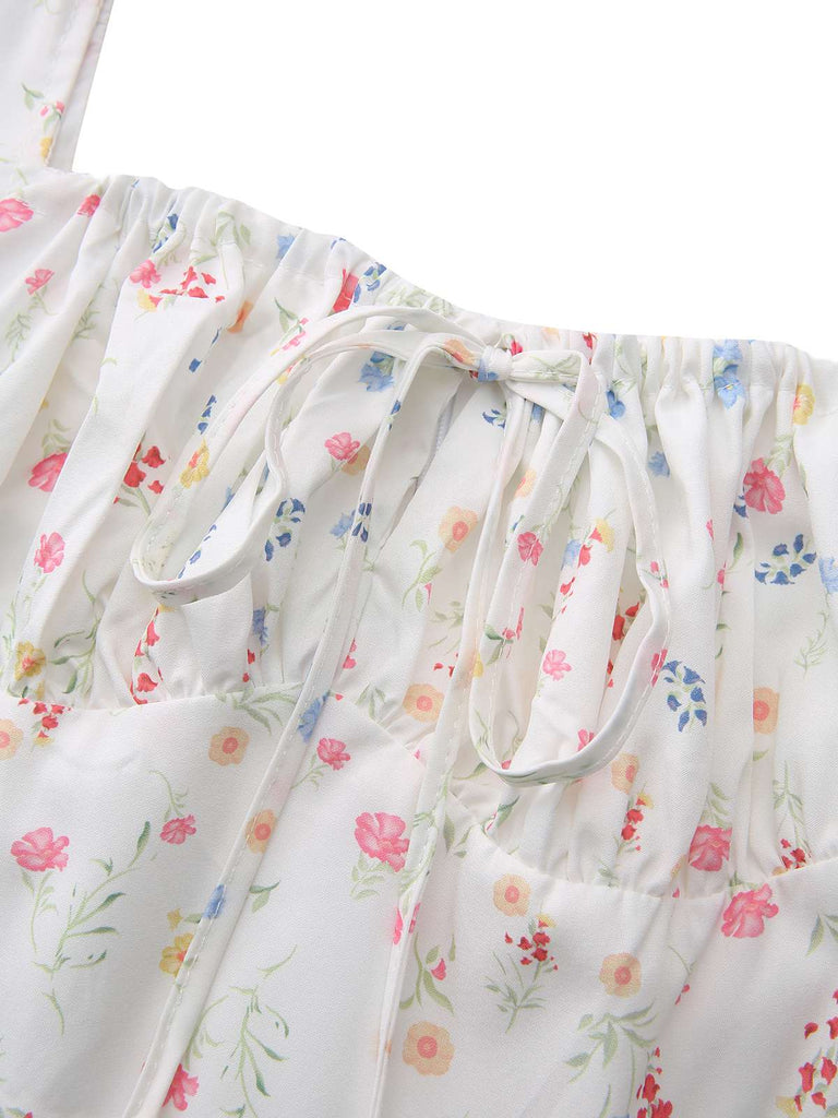 Abito a fiori con maniche a sbuffo e scollo quadrato bianco anni '30