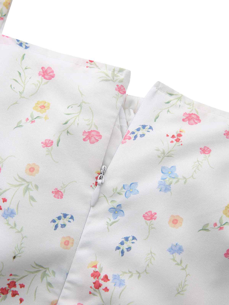Abito a fiori con maniche a sbuffo e scollo quadrato bianco anni '30