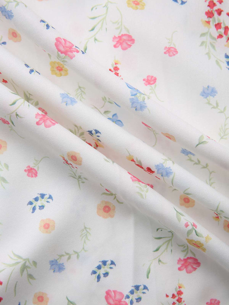 Abito a fiori con maniche a sbuffo e scollo quadrato bianco anni '30