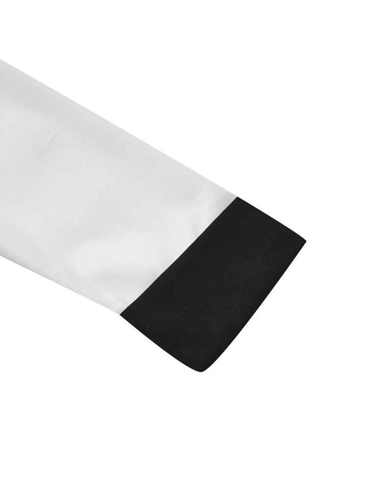 Abito con scollo a V profondo e bottoni a intaglio bianco e nero anni '40