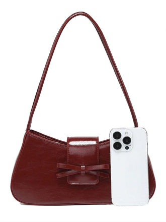 Borsa Baguette con fiocco in pelle vintage