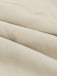 Close-up of beige fabric with a subtle texture