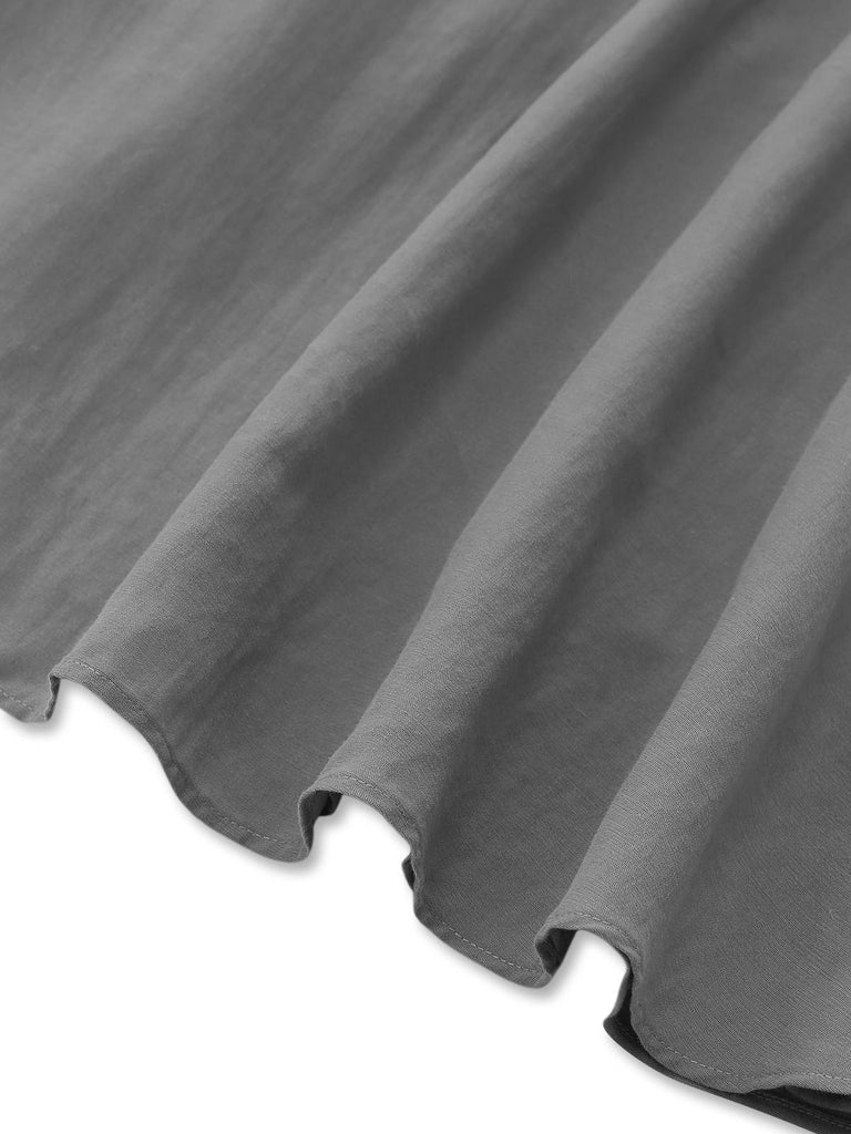 Gray halter dress hem detail showing clean finish and flattering length for versatile styling