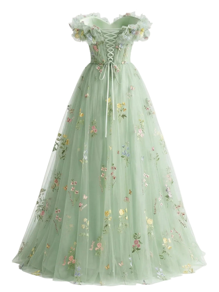 Green floral embroidered dress on a white background