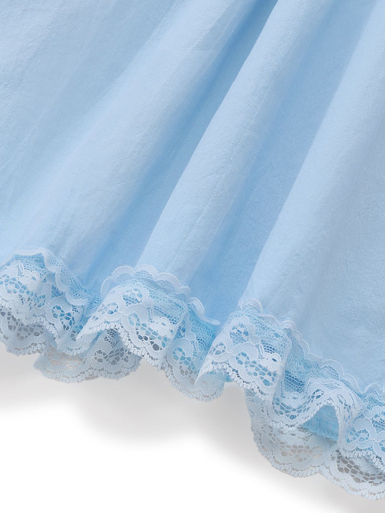 Abito babydoll in pizzo con fiocco sulla schiena anni '60