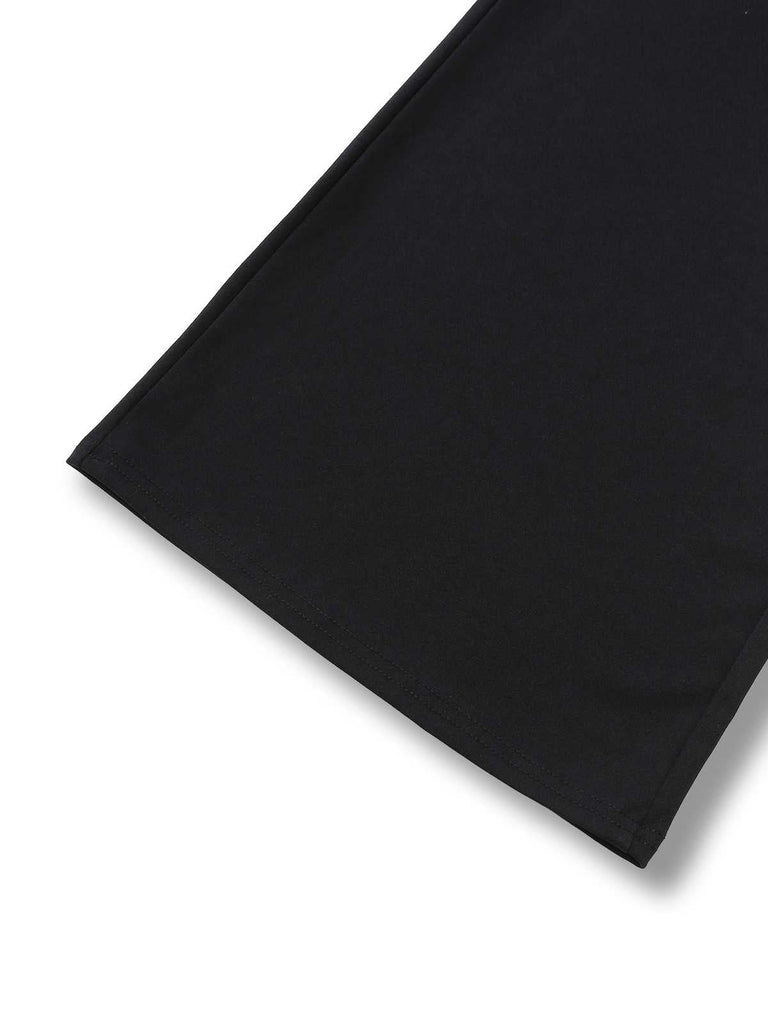 Tuta lunga spalle scoperte a contrasto con scollo a V profondo anni '70