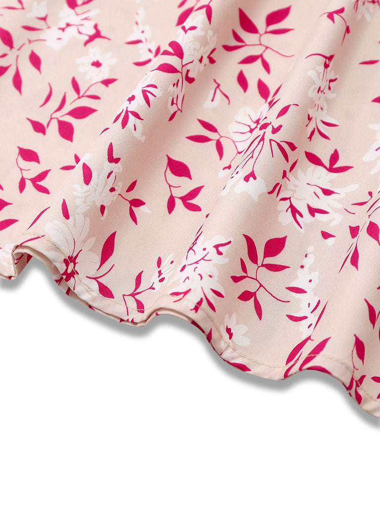 Abito floreale con scollo a V e maniche a sbuffo rosa anni '40