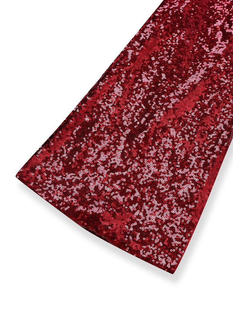 Tuta lunga da discoteca con paillettes e tracolla a catena anni '70