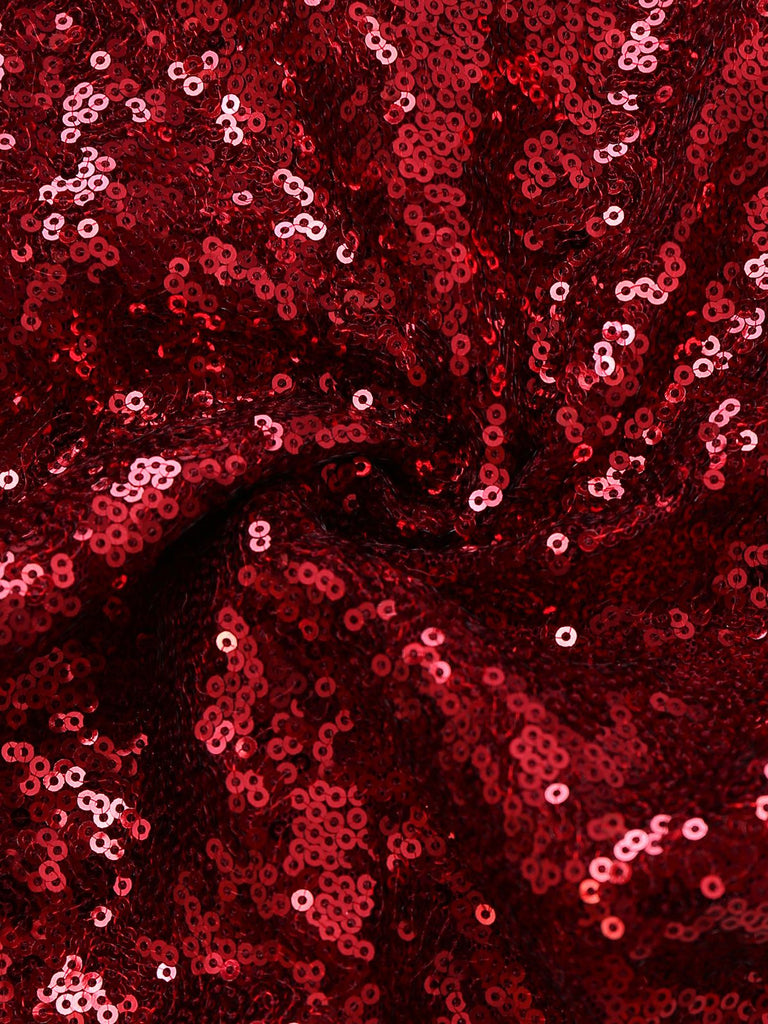 Tuta lunga da discoteca con paillettes e tracolla a catena anni '70