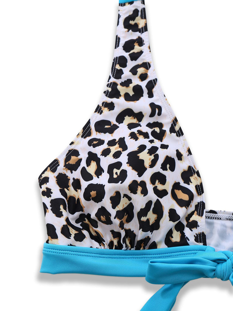 Leopard print bikini top with blue straps on a white background