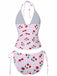 Two-piece swimsuit with cherry pattern on a white background