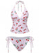 Two-piece swimsuit with cherry pattern on a white background