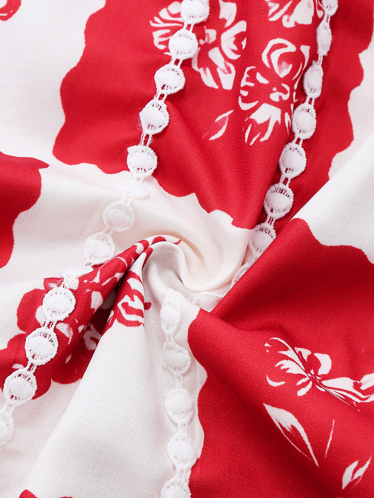 Close-up of red and white floral fabric with a necklace.