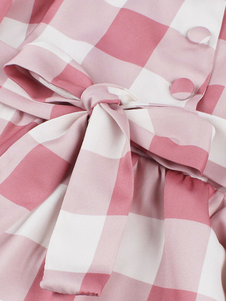 Abito a quadri con bottoni e fiocco rosa anni '50