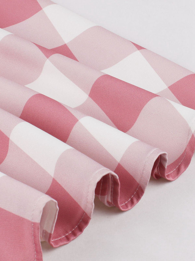 Abito a quadri con bottoni e fiocco rosa anni '50