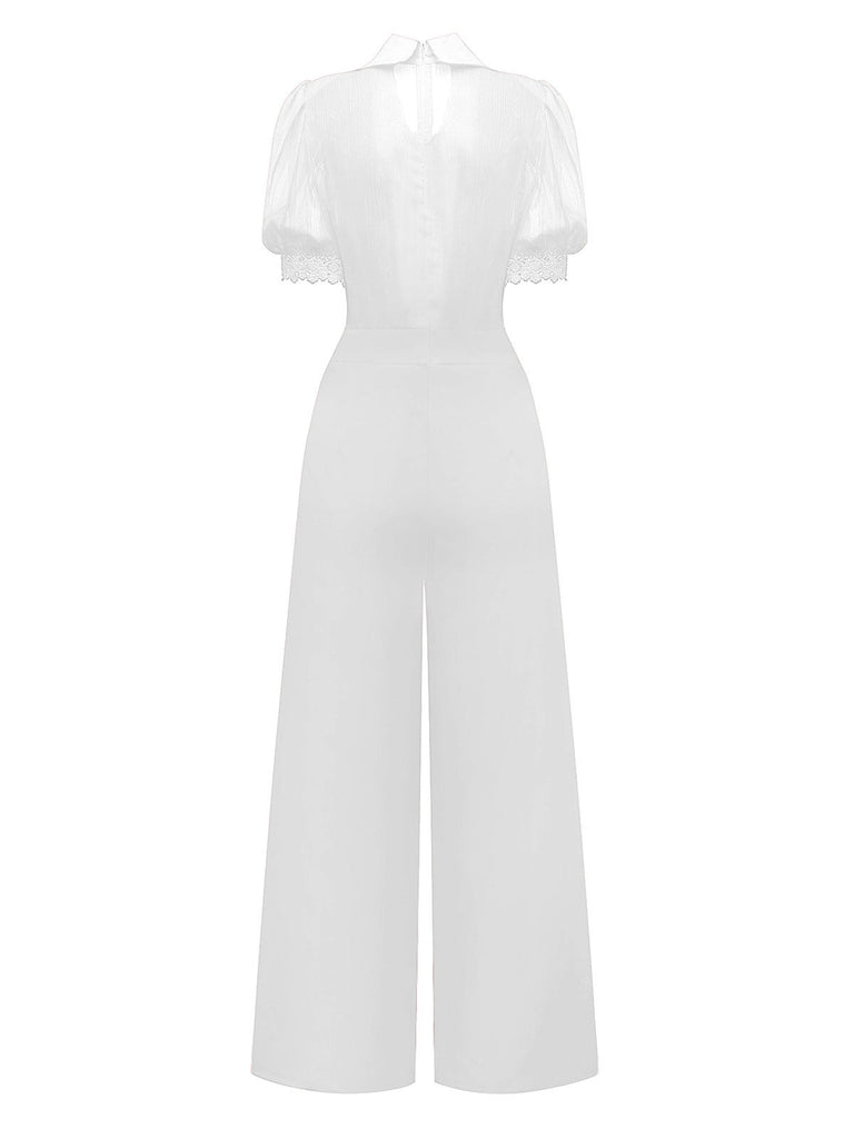 Tuta lunga con collo annodato in pizzo floreale e revers anni '50