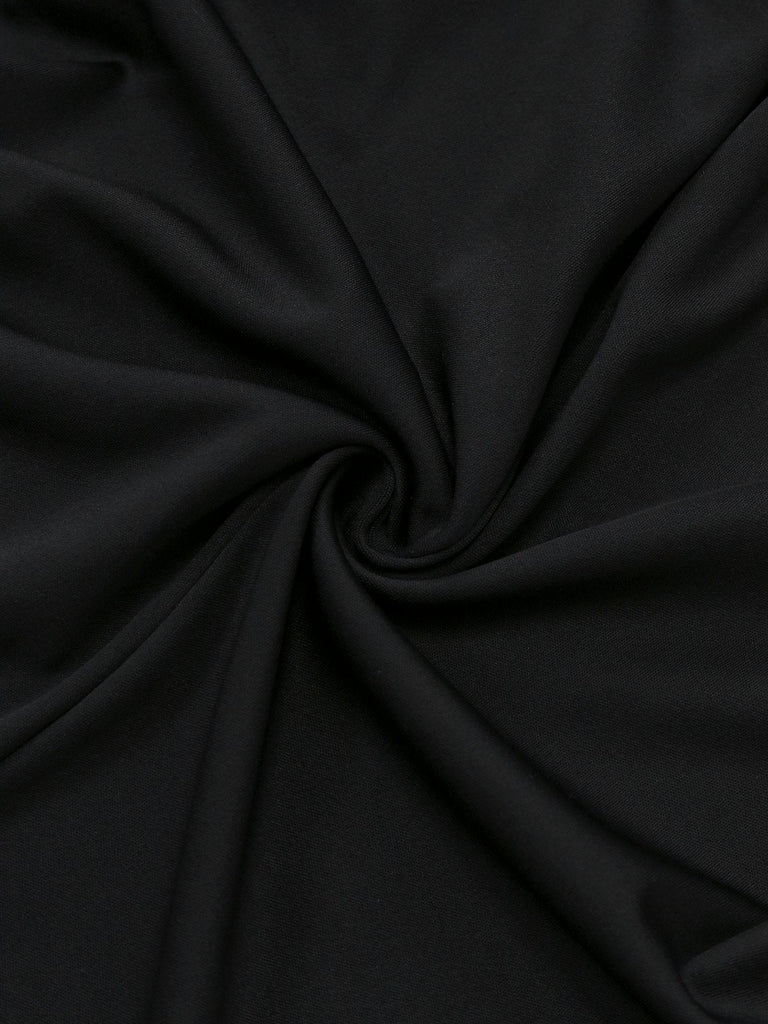 Abito con colletto a fiocco e bottoni e spacco frontale nero anni '30