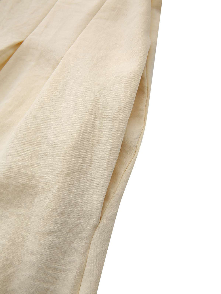 Abito con colletto a camicia e bottoni annodati in vita giallo anni '40