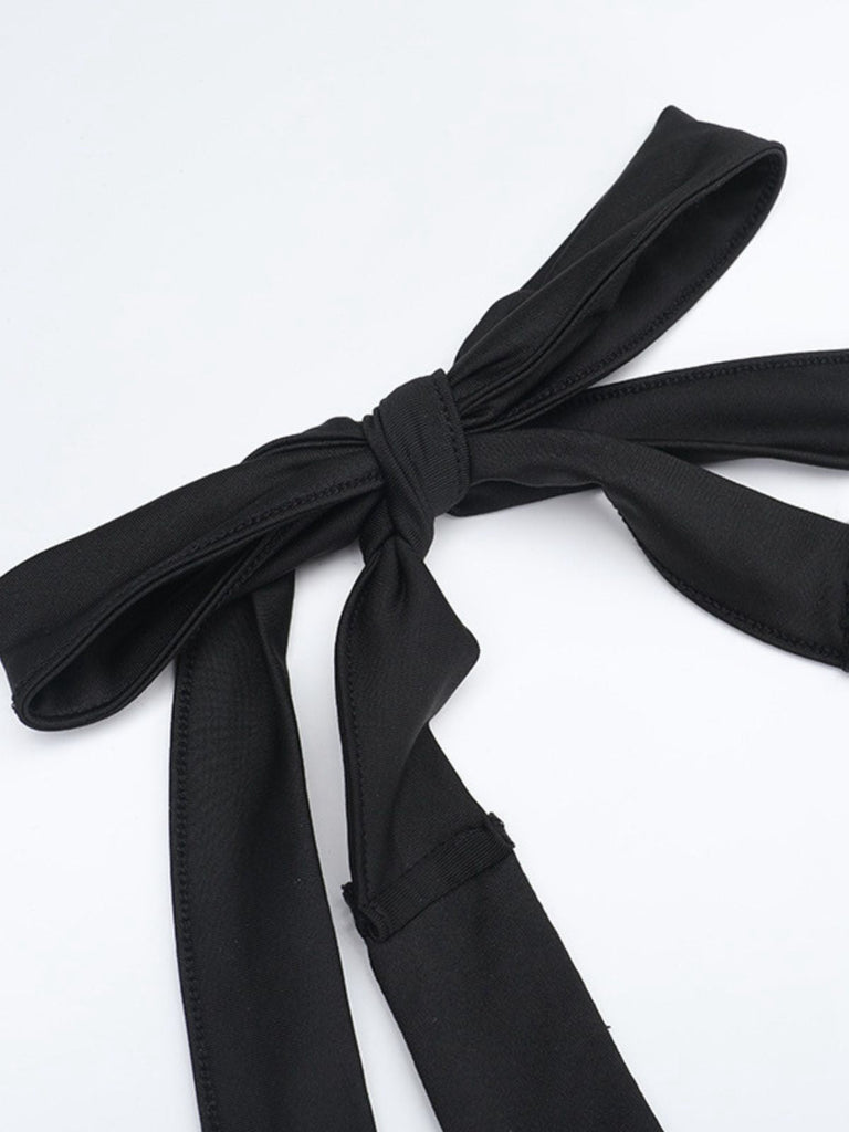 Tuta lunga svasata con scollo all'americana nero anni '80