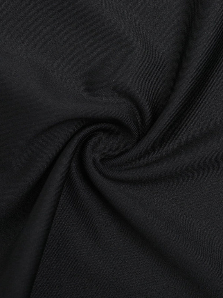 Tuta lunga svasata con scollo all'americana nero anni '80