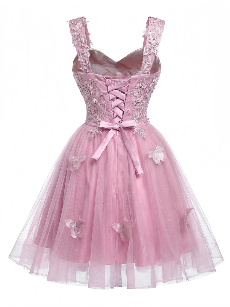Miniabito Homecoming rosa anni '60 in tulle glitterato con farfalle