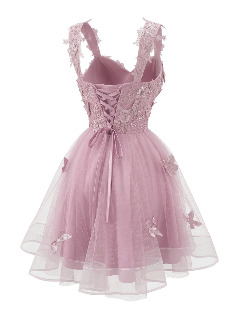 Miniabito Homecoming rosa anni '60 in tulle glitterato con farfalle