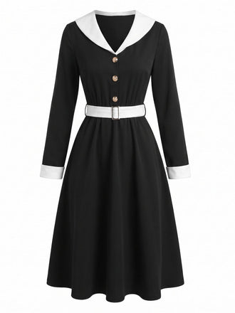 Abito anni '50 nero e bianco con revers e scollo a V e maniche lunghe