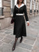 Abito anni '50 nero e bianco con revers e scollo a V e maniche lunghe 3