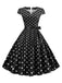 Abito a pois con maniche a cappuccio e cintura anni '50