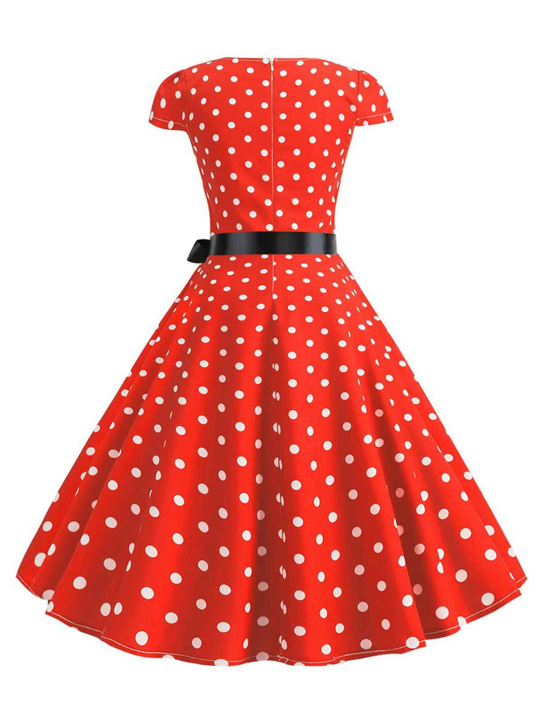 Abito a pois con maniche a cappuccio e cintura anni '50