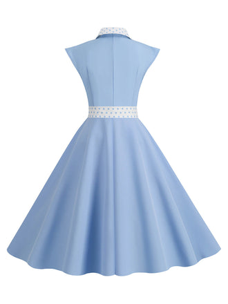 Abito a pois a contrasto con cintura e fiocco cielo azzurro anni '50