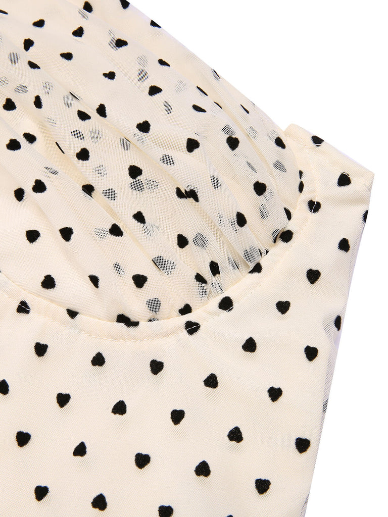 Tuta lunga a pois scollo all'americana beige e nero anni '50