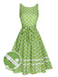 Abito a pois in pizzo con fiocco verde anni '50